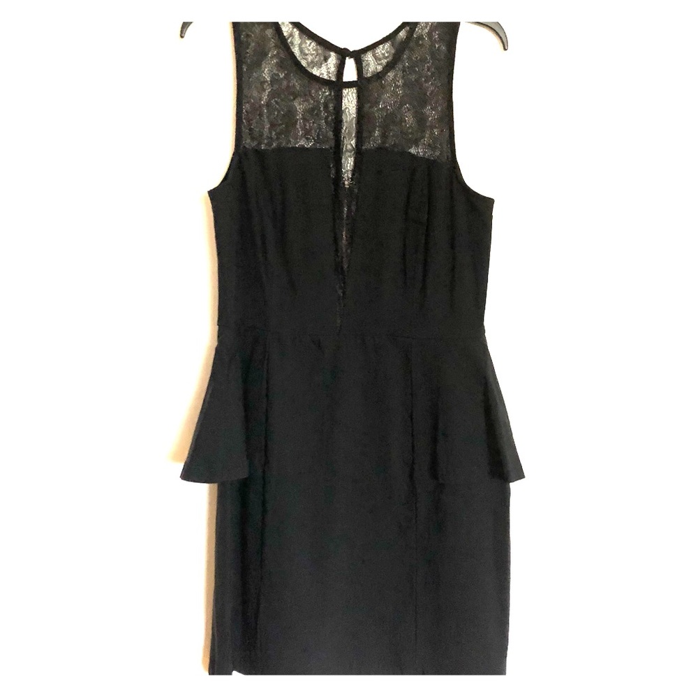 Short black peplum dress.